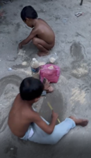 Children playing with sand and plastic bottles on Pulau Mabul