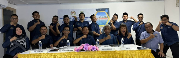 Teachers and staff of SK Pulau Mabul school